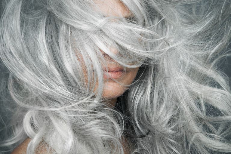 woman-with-grey-hair-blowing-across-her-face-royalty-free-image-1597686931